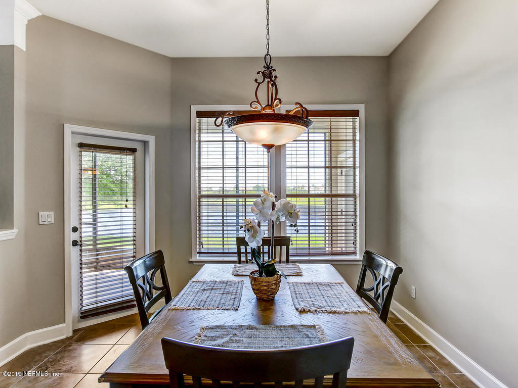 1780 North Loop Parkway St. Augustine, FL 32095 - Photo 26 of 98 a view of a dining room with furniture window and wooden floor