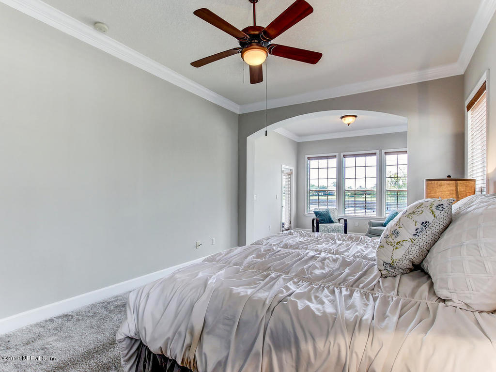 1780 North Loop Parkway St. Augustine, FL 32095 - Photo 34 of 98 a bedroom with a bed and window