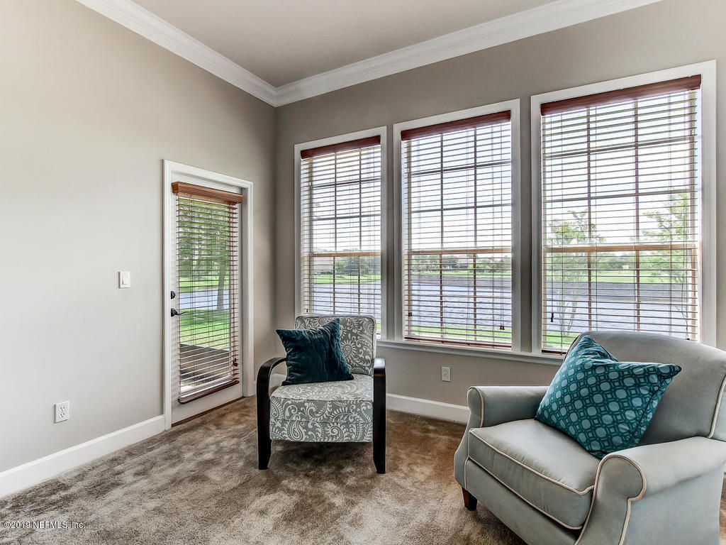 1780 North Loop Parkway St. Augustine, FL 32095 - Photo 35 of 98 a living room with furniture and a large window