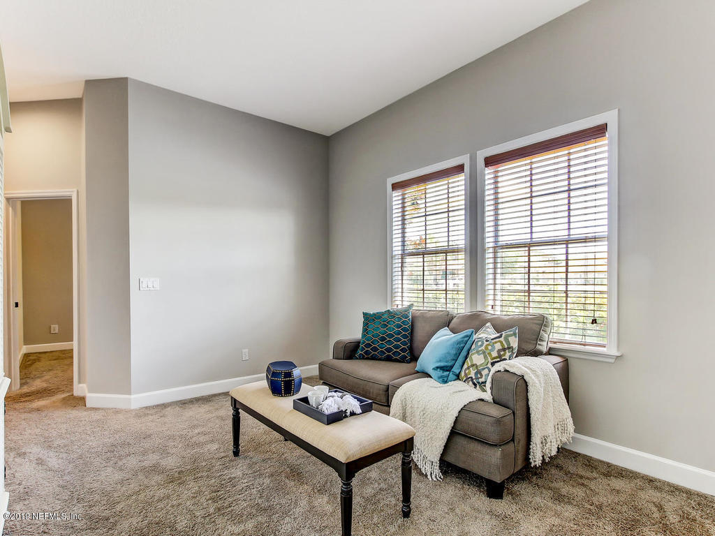 1780 North Loop Parkway St. Augustine, FL 32095 - Photo 42 of 98 a living room with furniture and a window