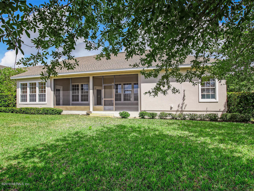 1780 North Loop Parkway St. Augustine, FL 32095 - Photo 51 of 98 front view of a house with a yard