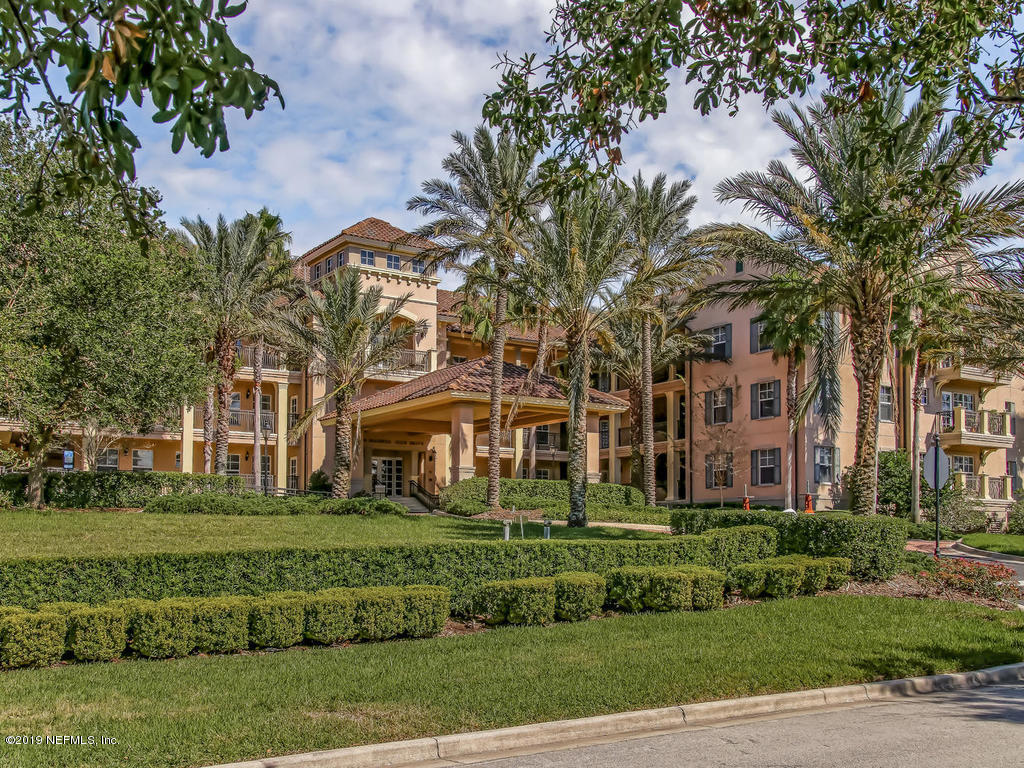1780 North Loop Parkway St. Augustine, FL 32095 - Photo 75 of 98 a front view of a building with a garden
