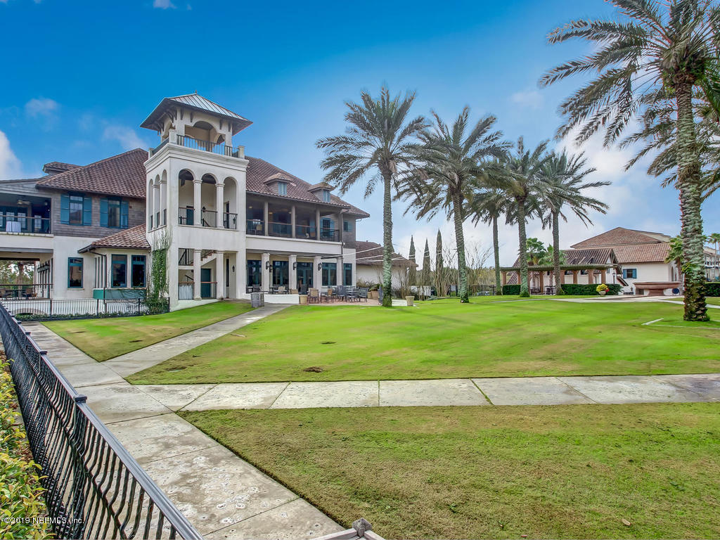 1780 North Loop Parkway St. Augustine, FL 32095 - Photo 78 of 98 a front view of a house with a yard table and chairs