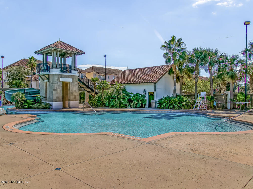 1780 North Loop Parkway St. Augustine, FL 32095 - Photo 81 of 98 a front view of a house with garden