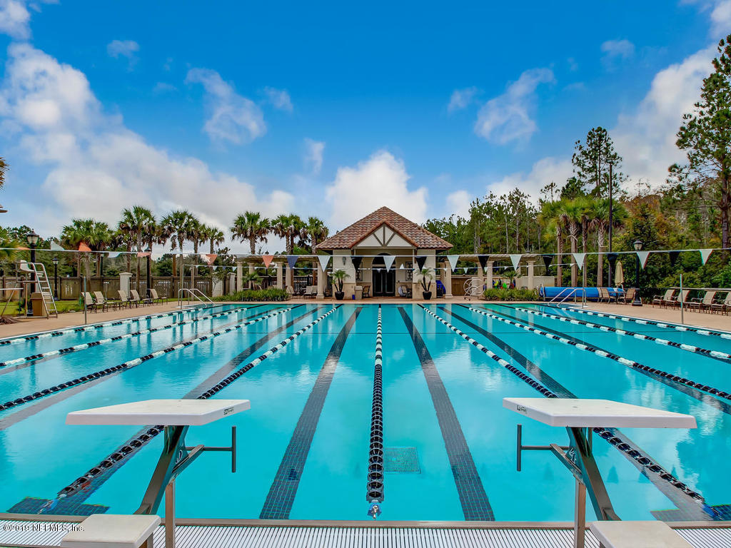 1780 North Loop Parkway St. Augustine, FL 32095 - Photo 85 of 98 a view of a chairs and table on the deck