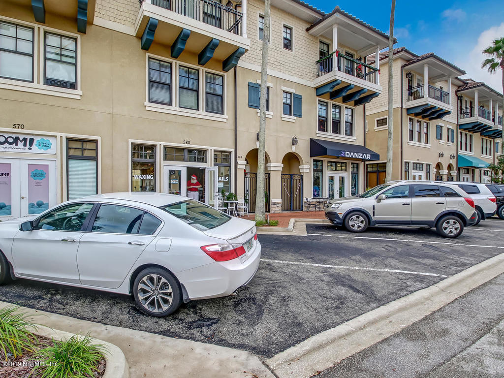 1780 North Loop Parkway St. Augustine, FL 32095 - Photo 97 of 98 a car parked in front of a white house