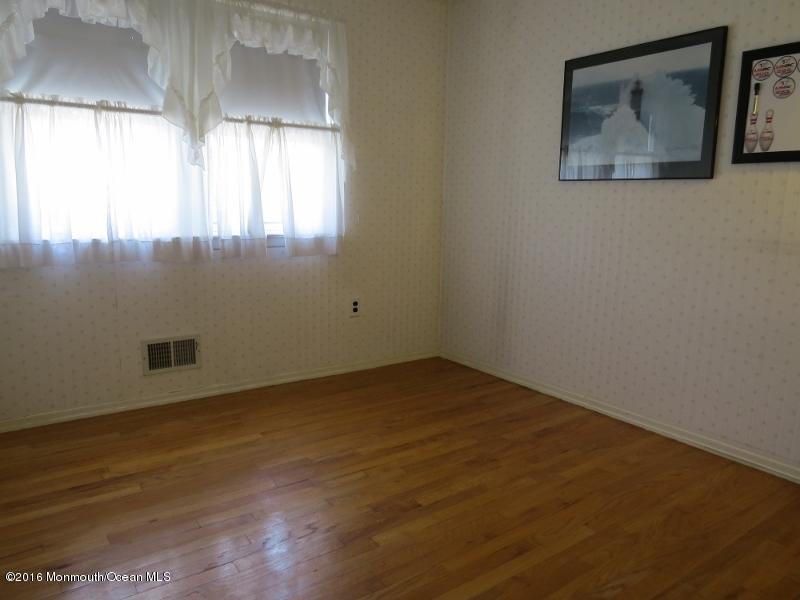 200 Bethany Road Hazlet, NJ 07730 - Photo 11 of 22 a view of an empty room with a window