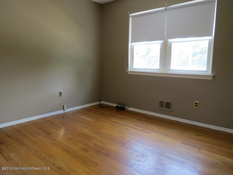 200 Bethany Road Hazlet, NJ 07730 - Photo 12 of 22 a view of a room with wooden floor and windows
