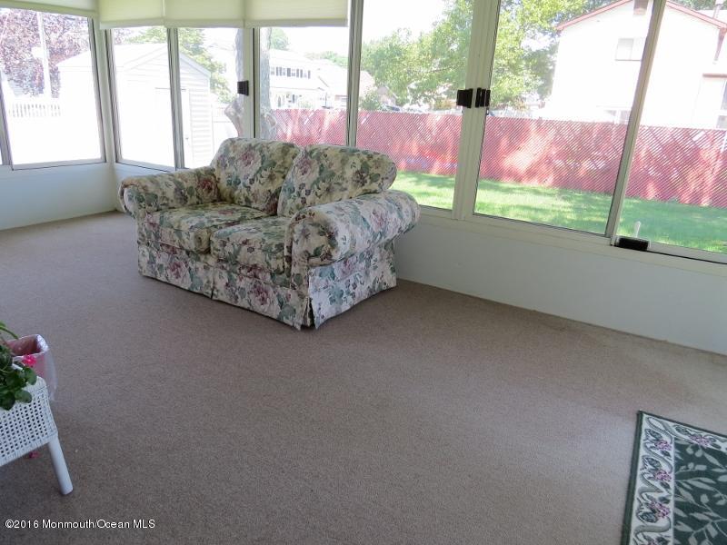 200 Bethany Road Hazlet, NJ 07730 - Photo 19 of 22 a living room with couch and a floor to ceiling window