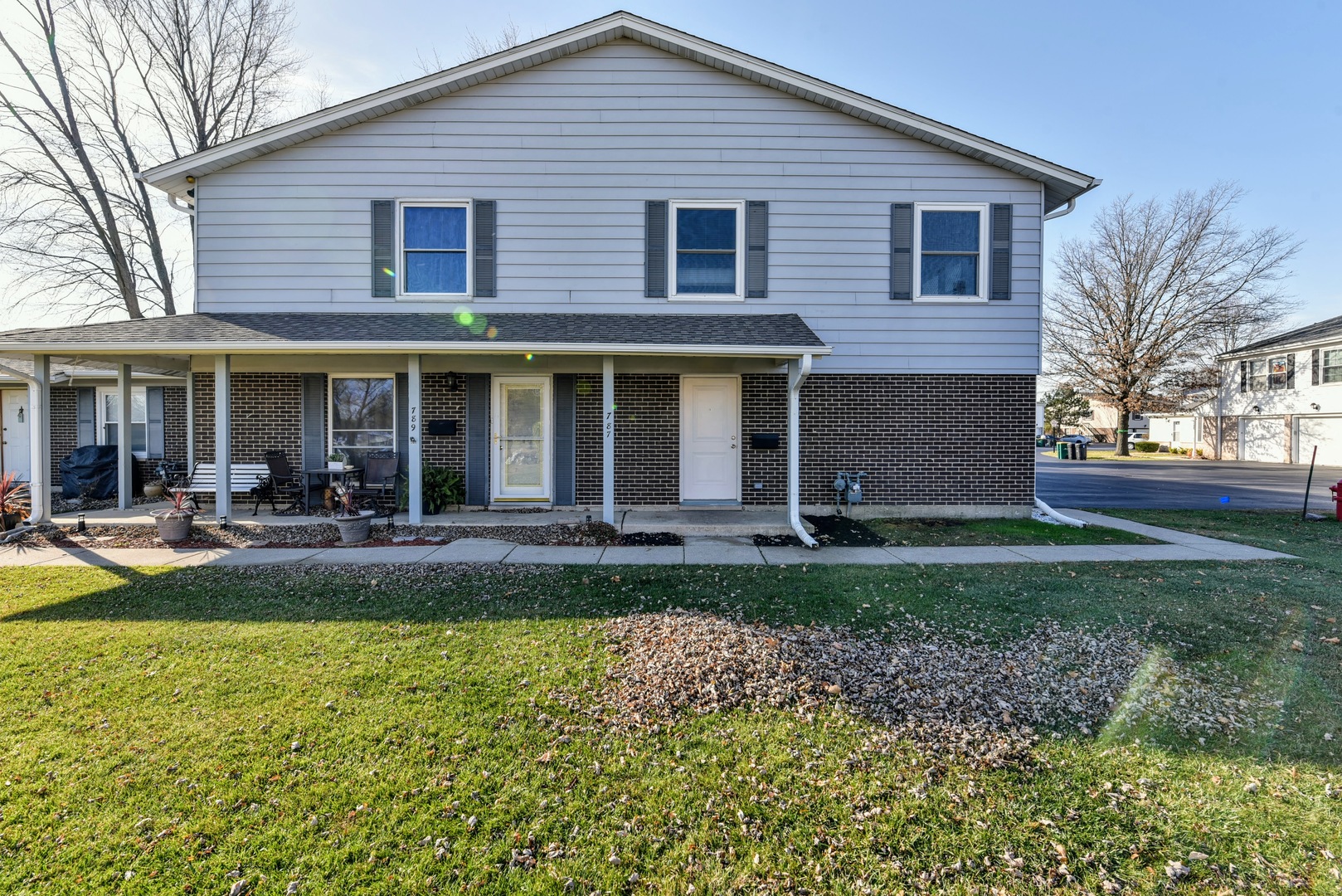 a view of a house with a yard patio and swimming pool