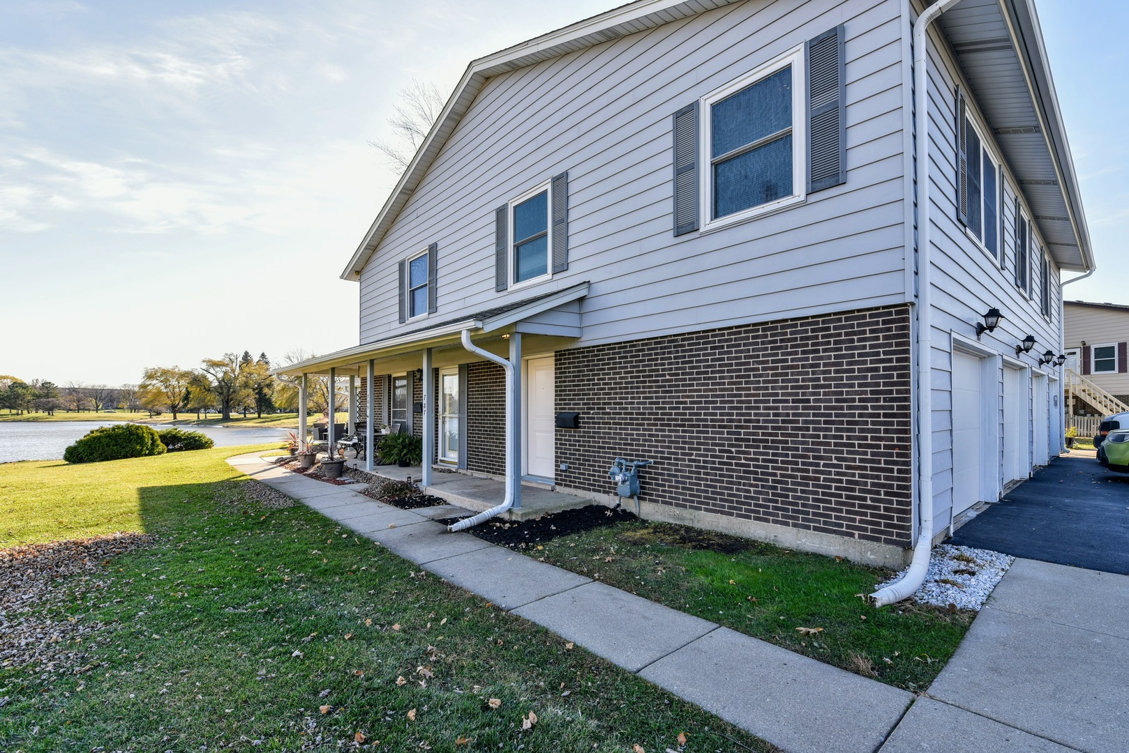 787 Pahl Road, Unit 787 Elk Grove Village, IL 60007 - Photo 2 of 28 a view of a house with a yard and sitting area