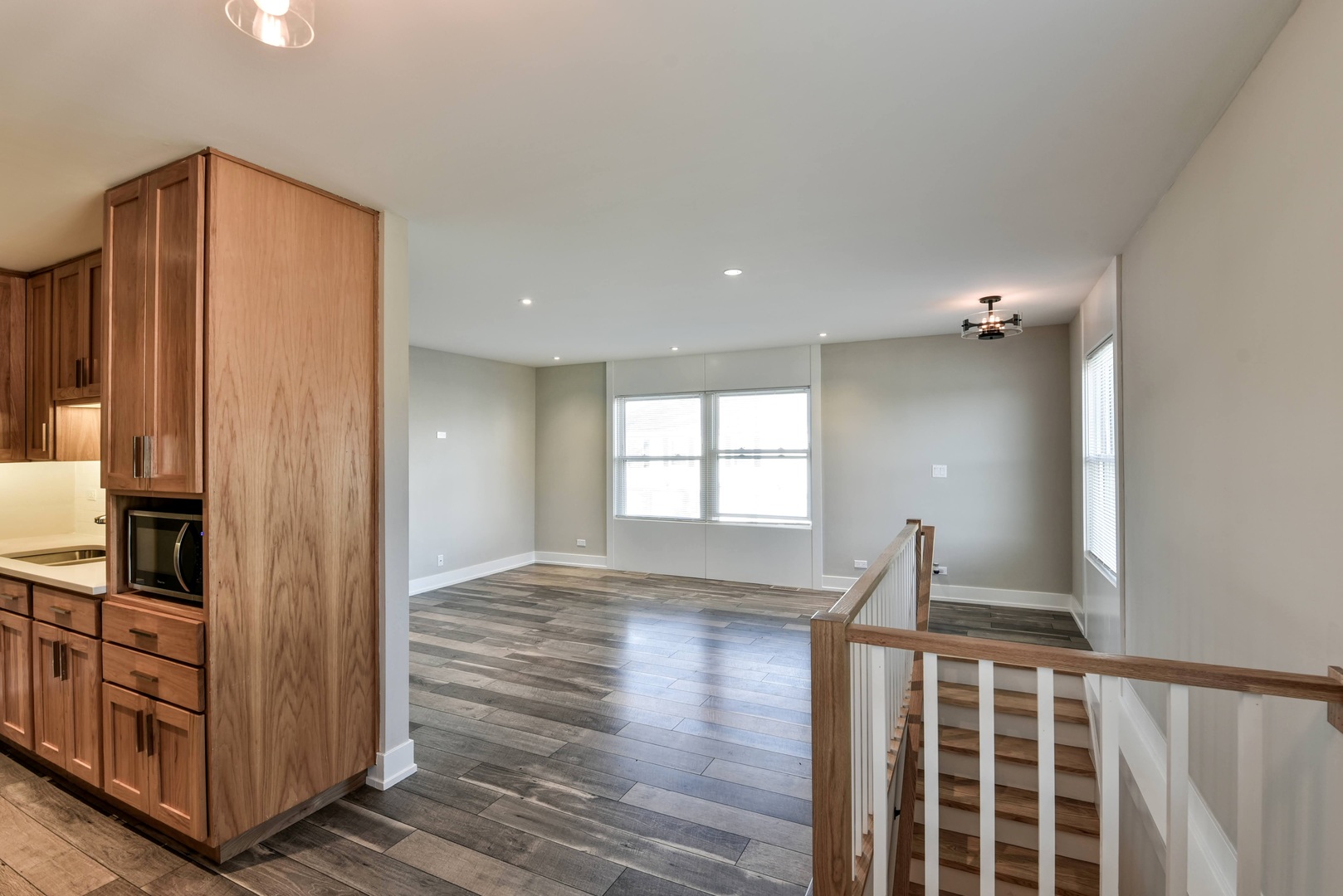 787 Pahl Road, Unit 787 Elk Grove Village, IL 60007 - Photo 12 of 28 a view of empty room with wooden floor and fan