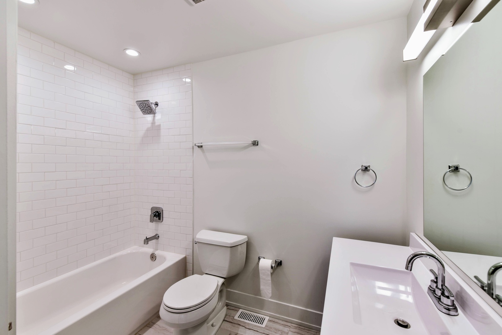 787 Pahl Road, Unit 787 Elk Grove Village, IL 60007 - Photo 14 of 28 a bathroom with a sink a toilet and shower