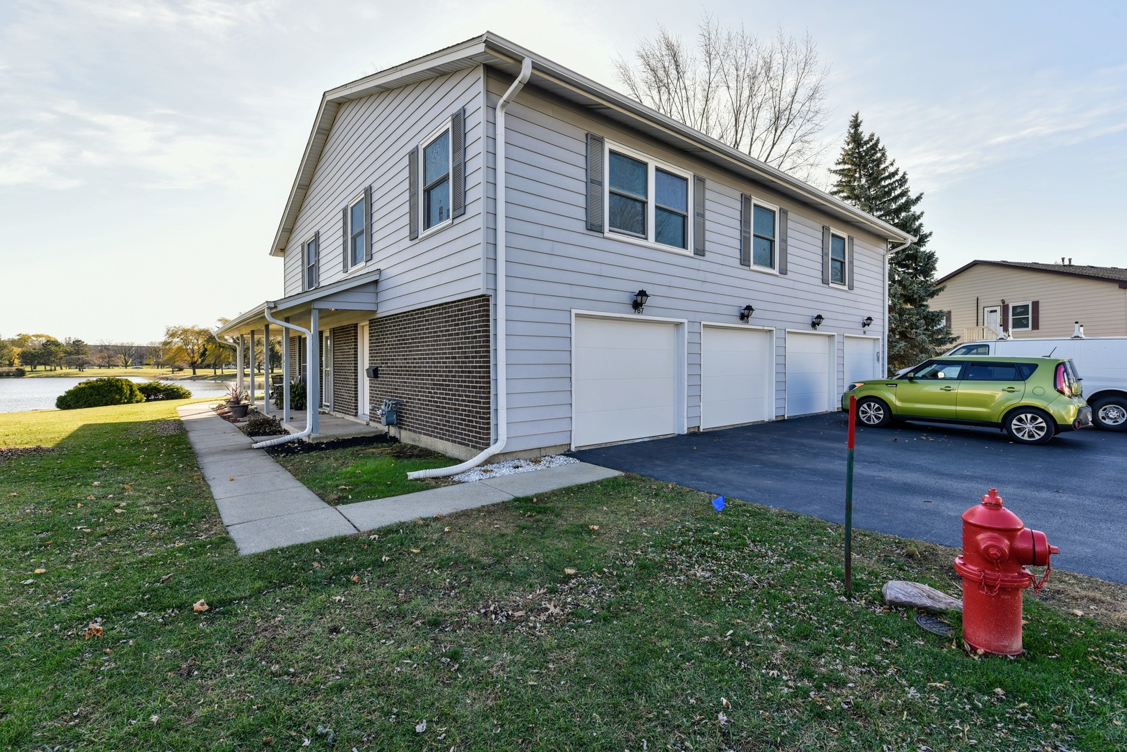 787 Pahl Road, Unit 787 Elk Grove Village, IL 60007 - Photo 3 of 28 a front view of a house with a yard
