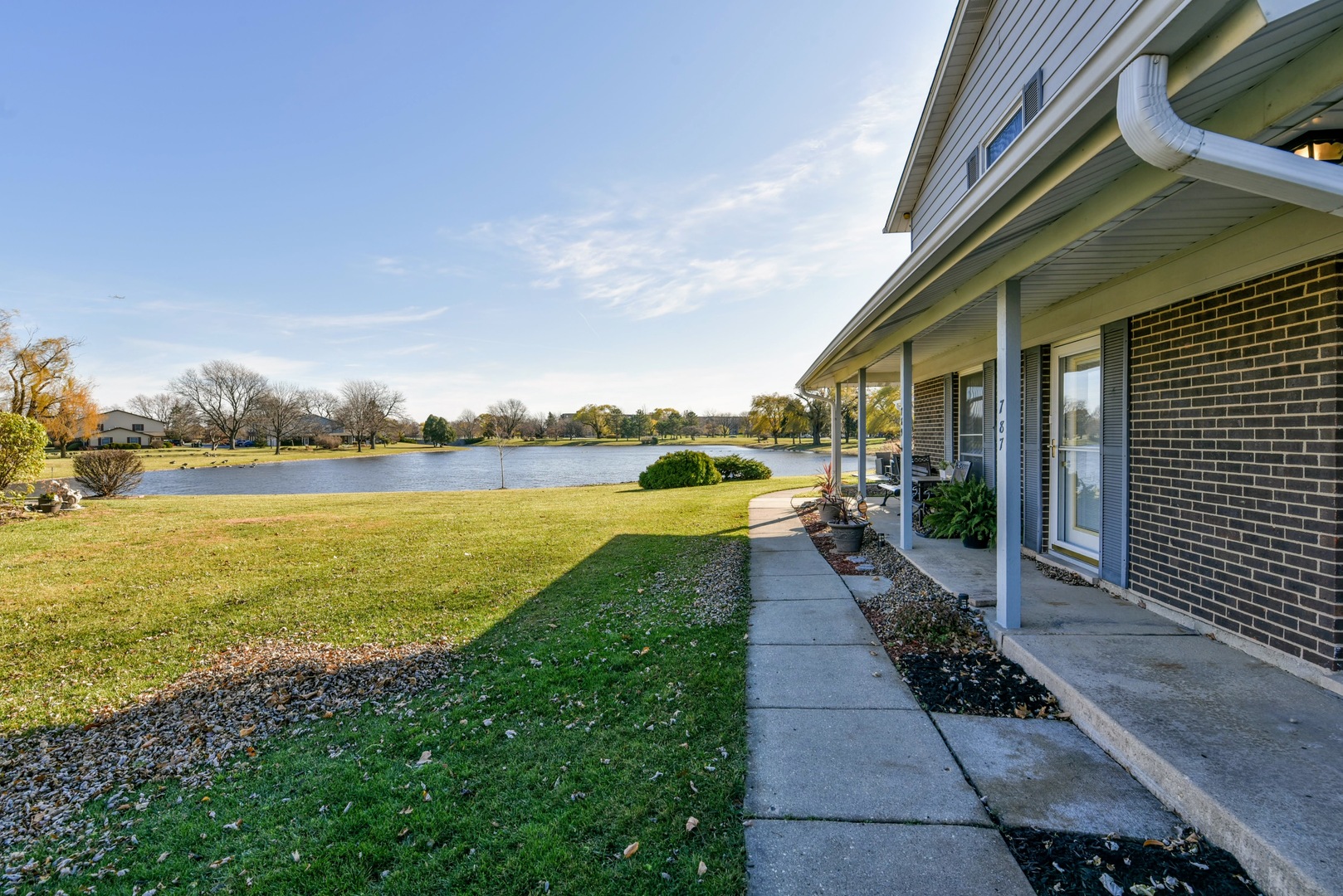 787 Pahl Road, Unit 787 Elk Grove Village, IL 60007 - Photo 26 of 28 a view of a lake with a garden