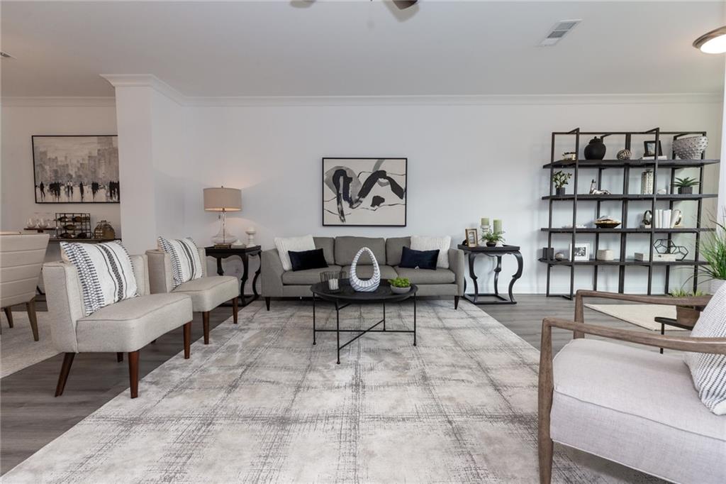 3167 Moor View Road, Unit 35 Duluth, GA 30096 - Photo 1 of 1 a living room with furniture and painting on the wall