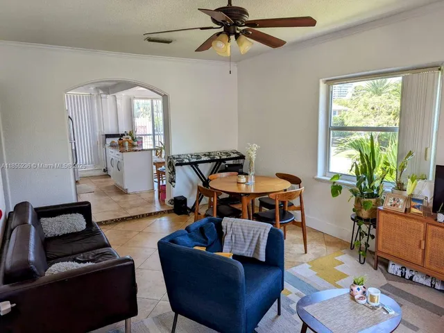 a living room with furniture and a window