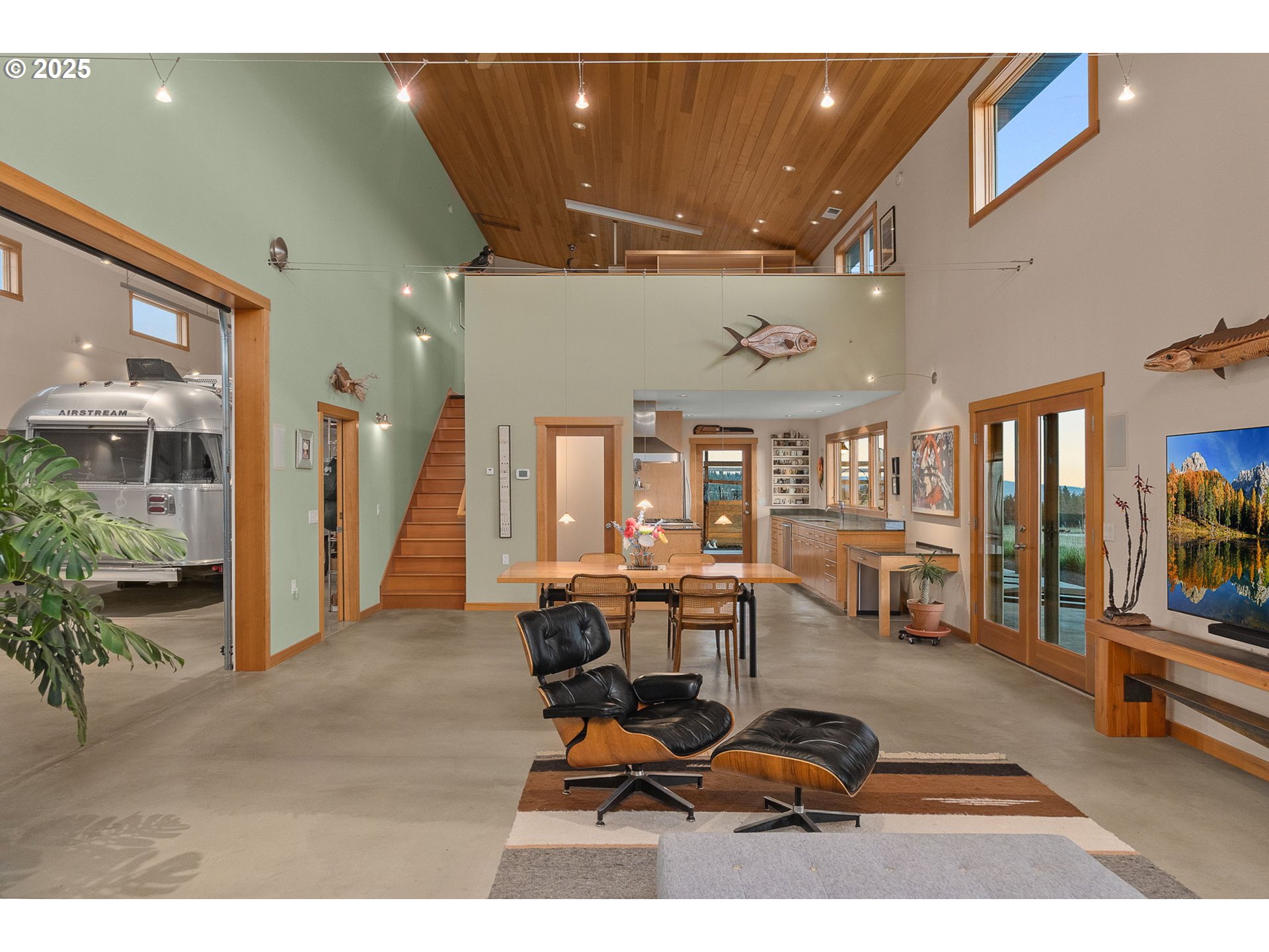 505 Knight Road Goldendale, WA 98620 - Photo 12 of 41 a living room with furniture a flat screen tv and a large window