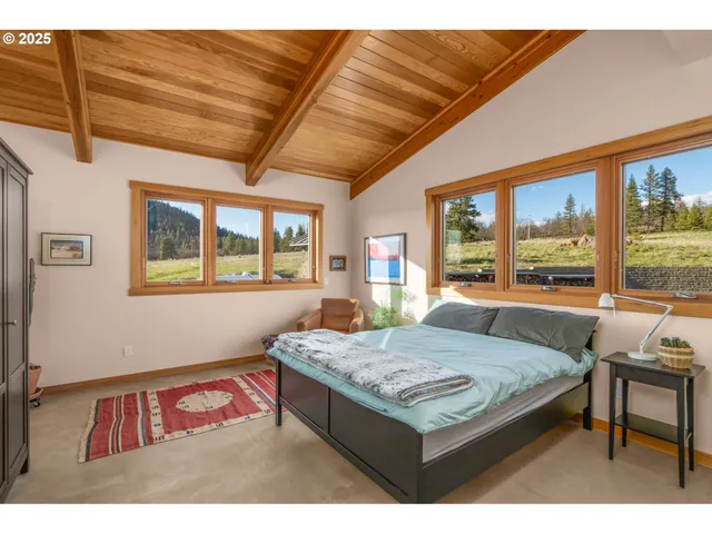 a living room with granite countertop furniture and floor to ceiling window