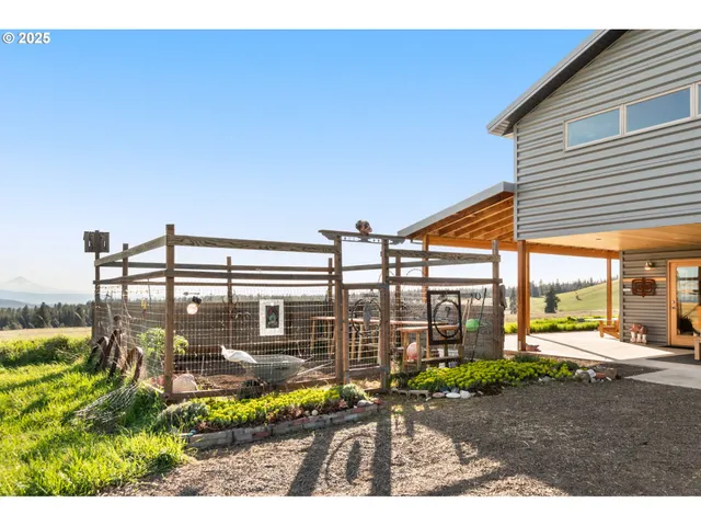 a view of a swimming pool with outdoor seating
