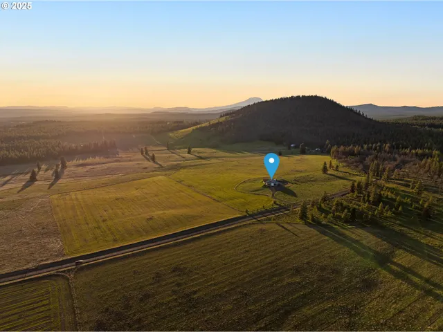 a view of an ocean with a mountain