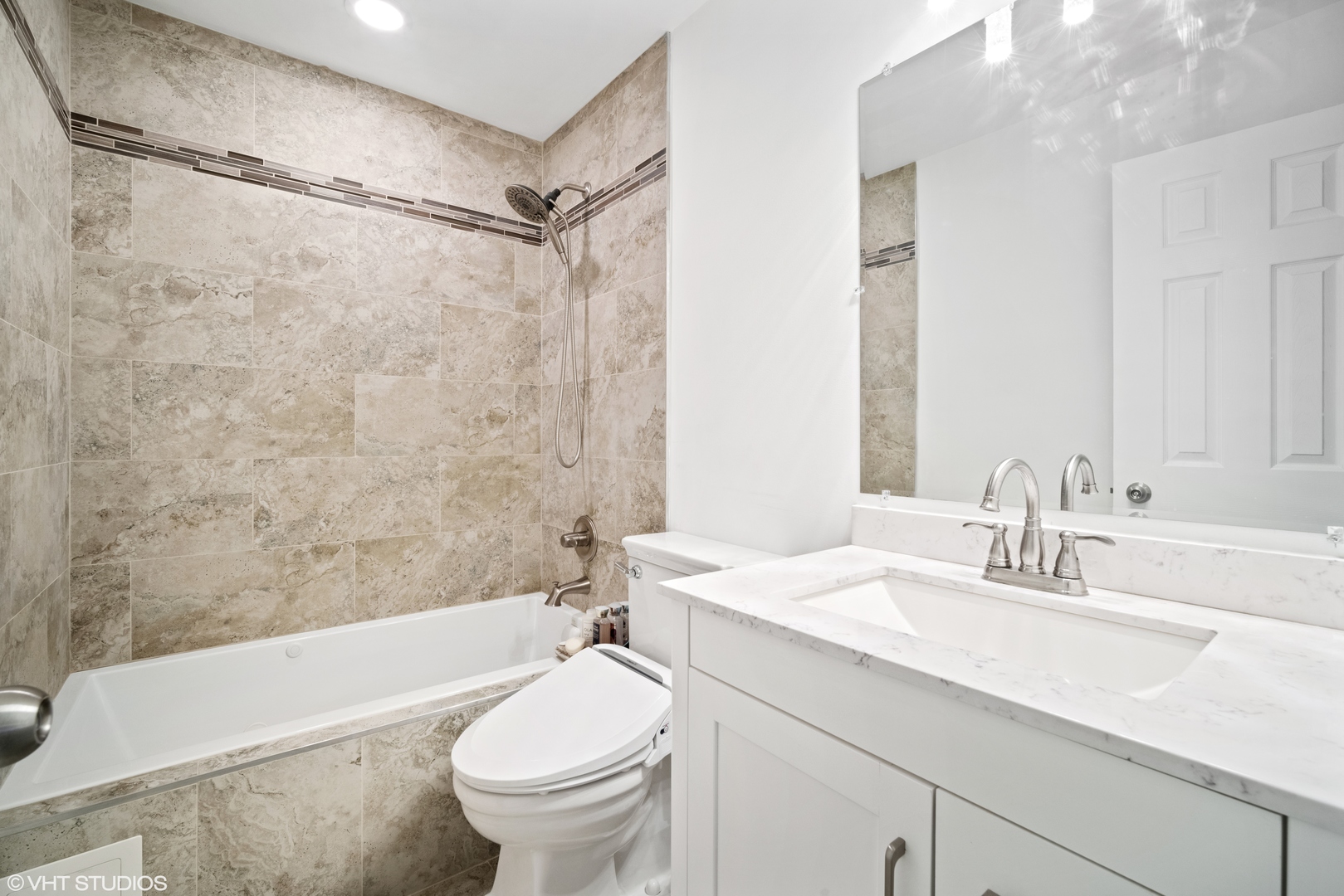 320 Sheridan Drive, Unit 2C Willowbrook, IL 60527 - Photo 11 of 20 a bathroom with a sink a toilet and a bathtub