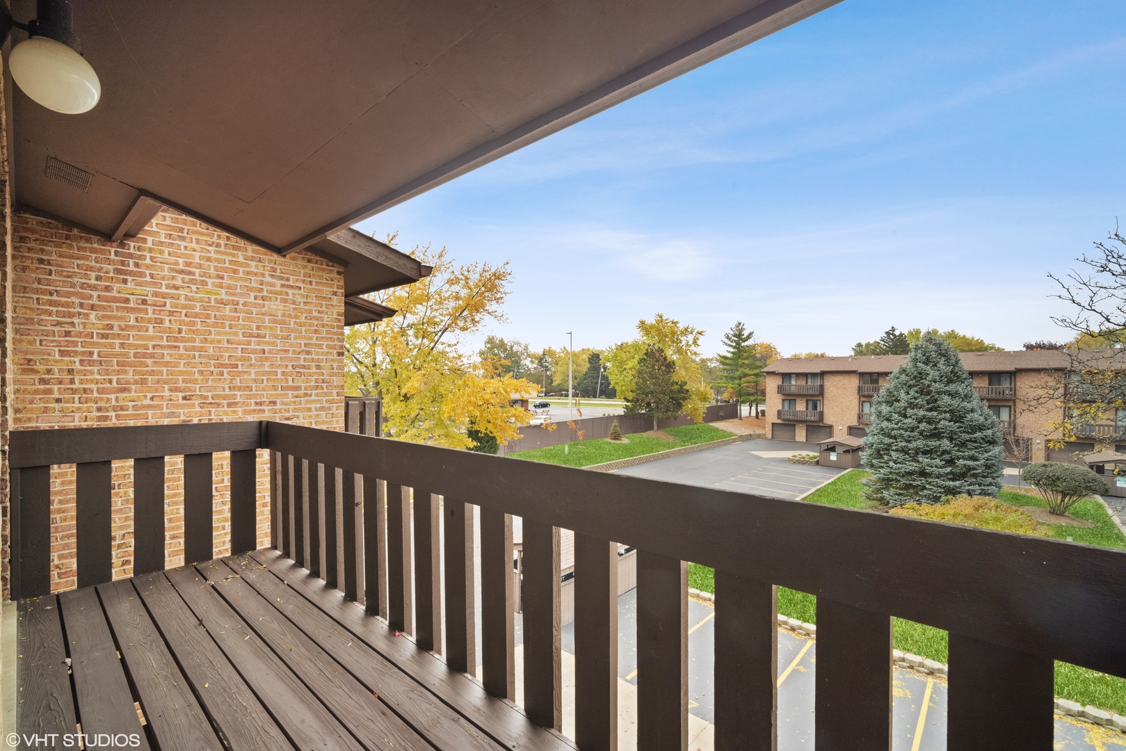 320 Sheridan Drive, Unit 2C Willowbrook, IL 60527 - Photo 15 of 20 a balcony with wooden floor and city view