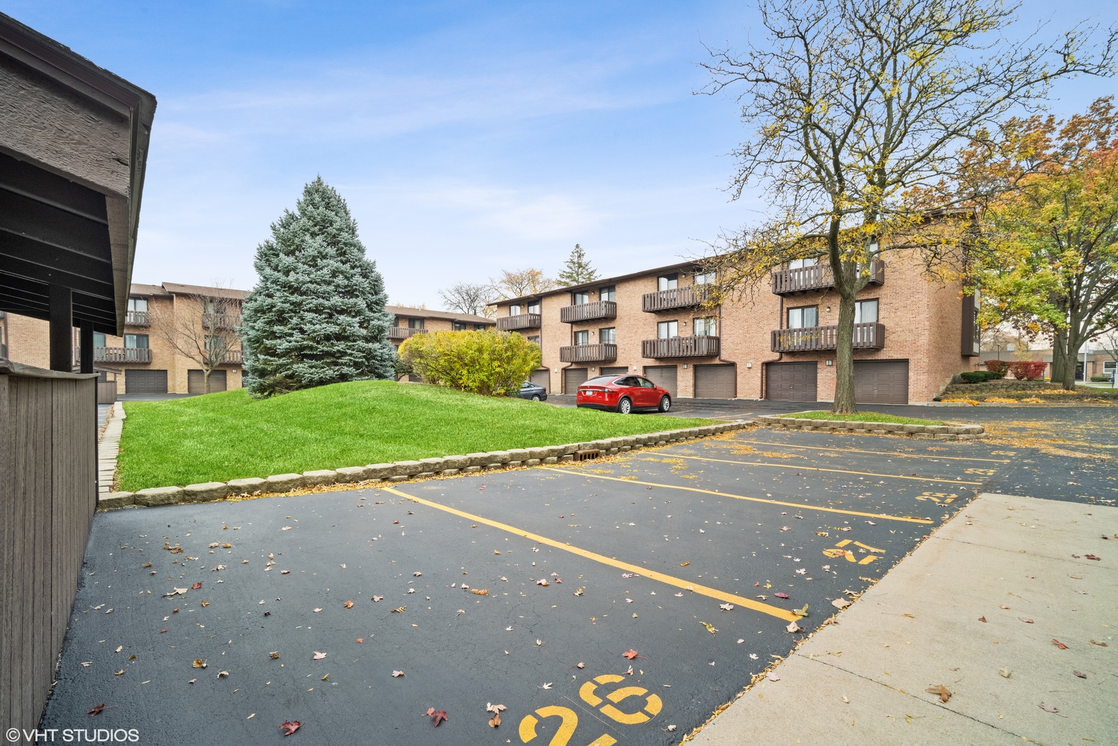320 Sheridan Drive, Unit 2C Willowbrook, IL 60527 - Photo 19 of 20 a view of a city street lined with buildings and trees