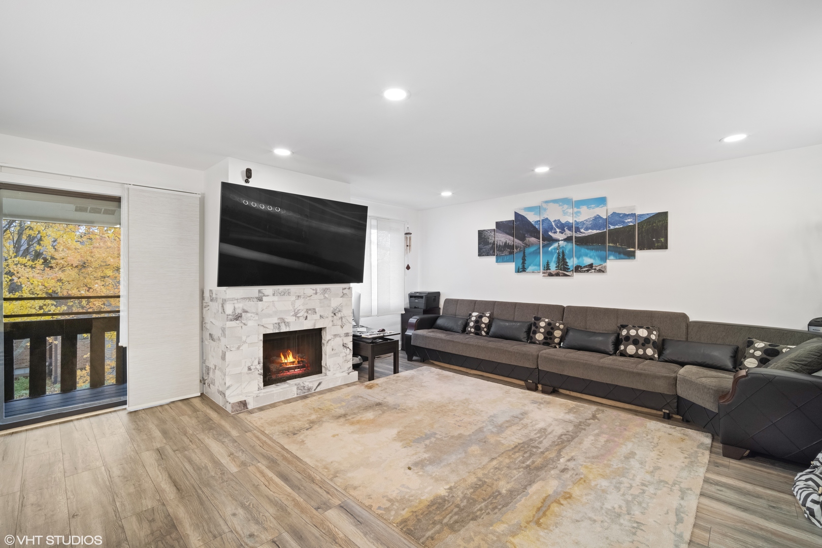 320 Sheridan Drive, Unit 2C Willowbrook, IL 60527 - Photo 4 of 20 a living room with furniture fireplace and flat screen tv