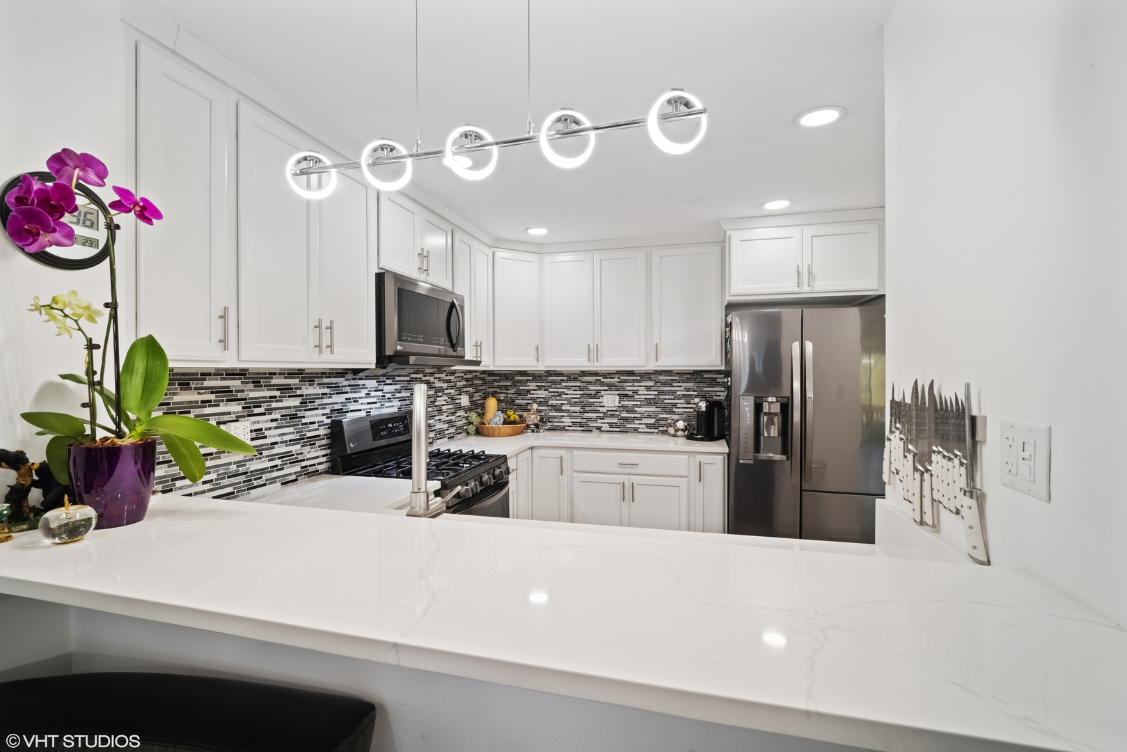 320 Sheridan Drive, Unit 2C Willowbrook, IL 60527 - Photo 6 of 20 a kitchen with granite countertop a sink stainless steel appliances and cabinets