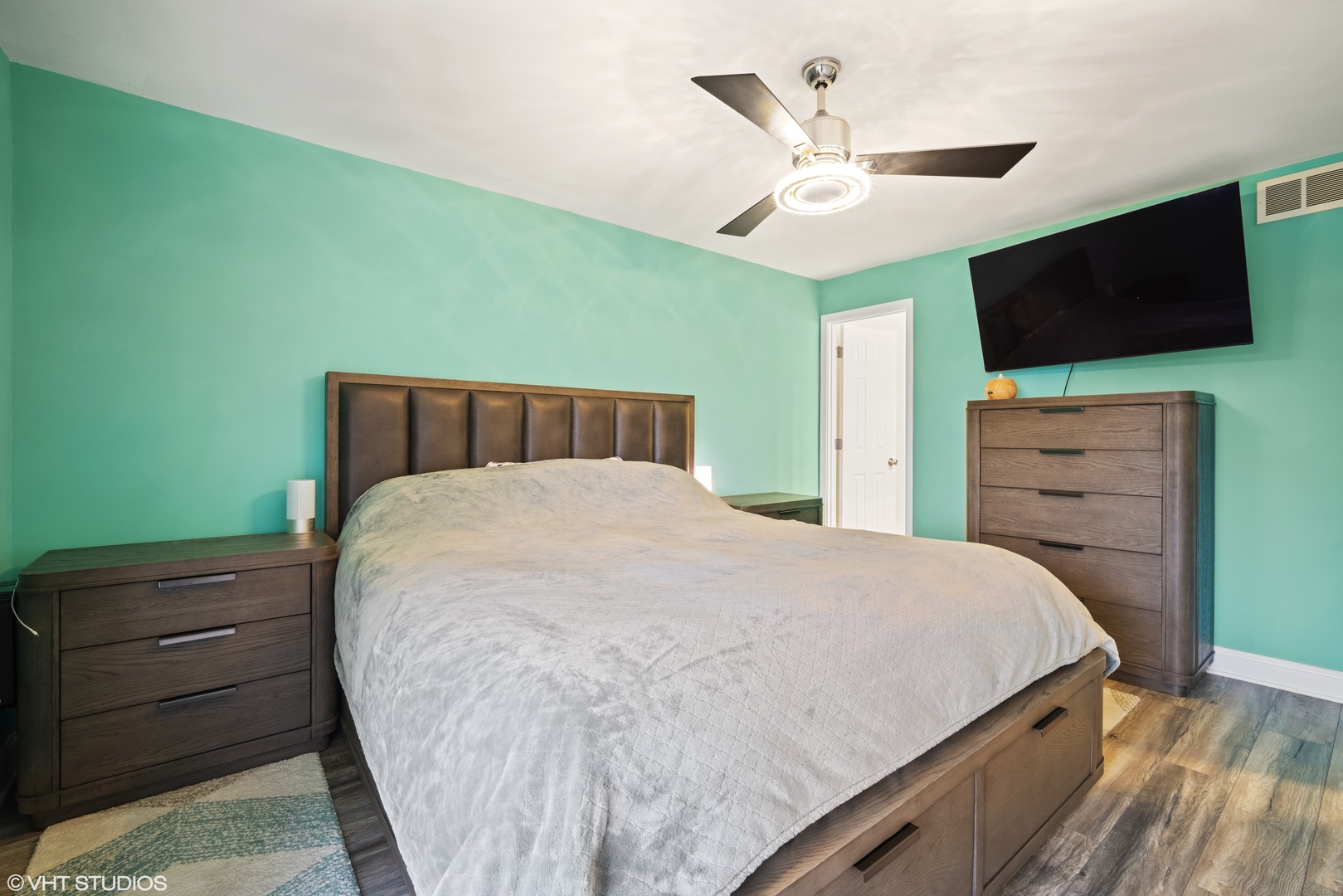 320 Sheridan Drive, Unit 2C Willowbrook, IL 60527 - Photo 10 of 20 a bedroom with a bed and a flat screen tv