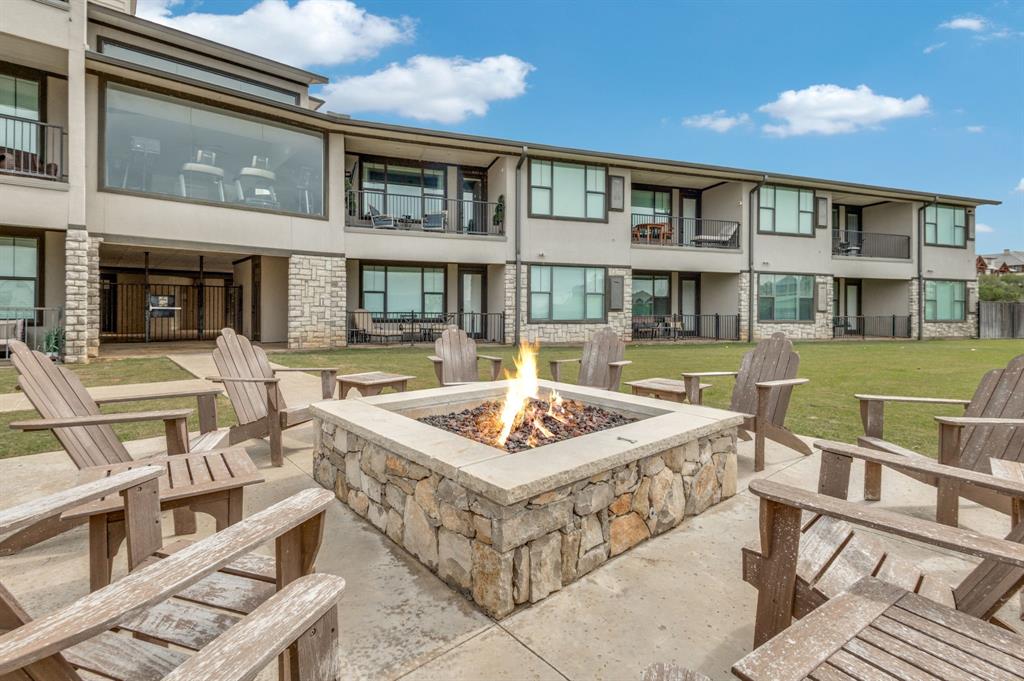 3412 Scenic Point Road, Unit 102 Graford, TX 76449 - Photo 24 of 31 a front view of a building with outdoor seating