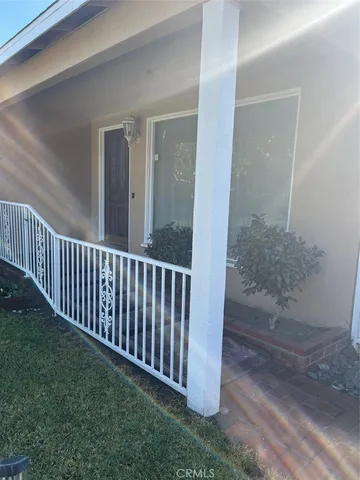 a view of a porch with wooden floor