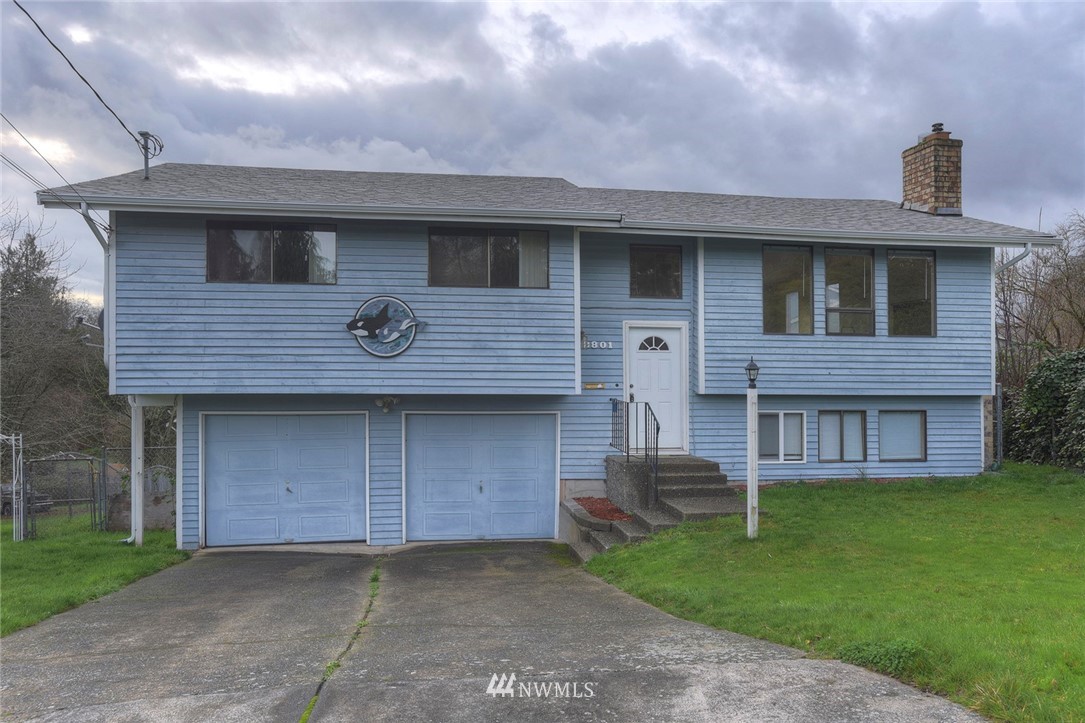2801 Sierra Road Bremerton, WA 98310 - Photo 1 of 23 a front view of a house with a garden and plants