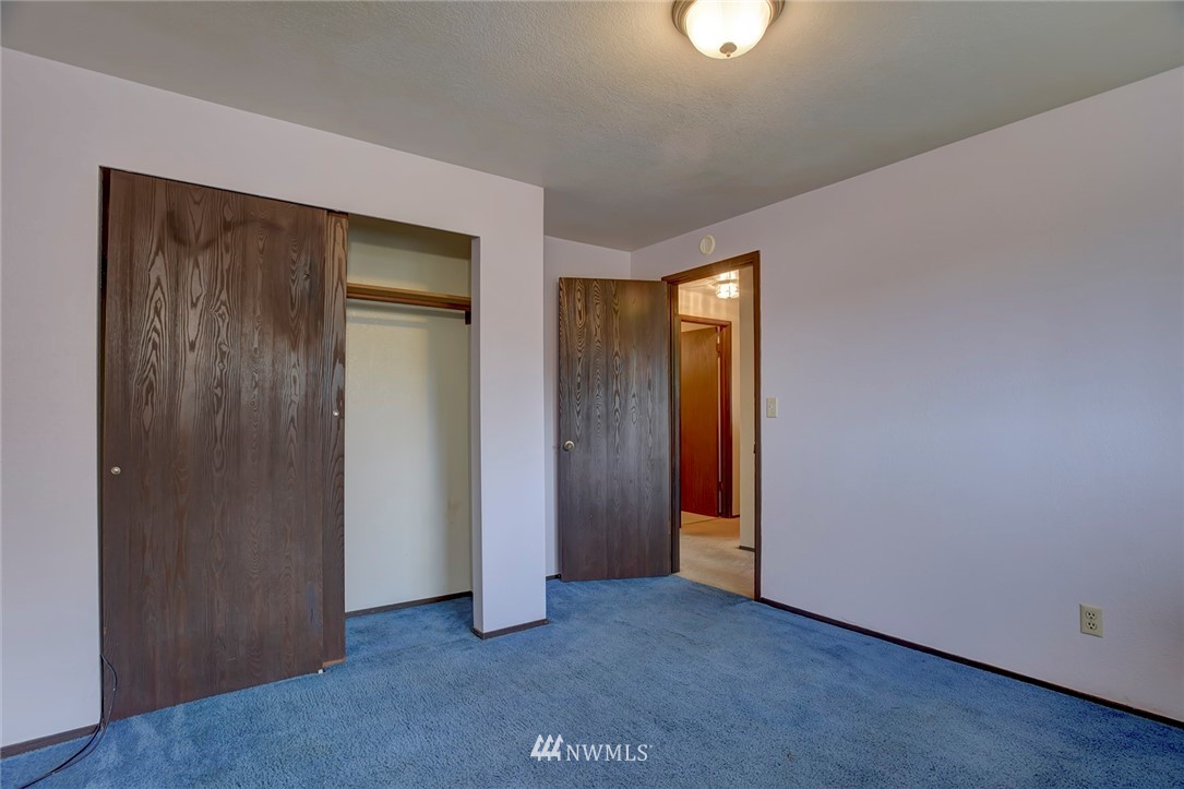 2801 Sierra Road Bremerton, WA 98310 - Photo 12 of 23 an empty room with closet and windows