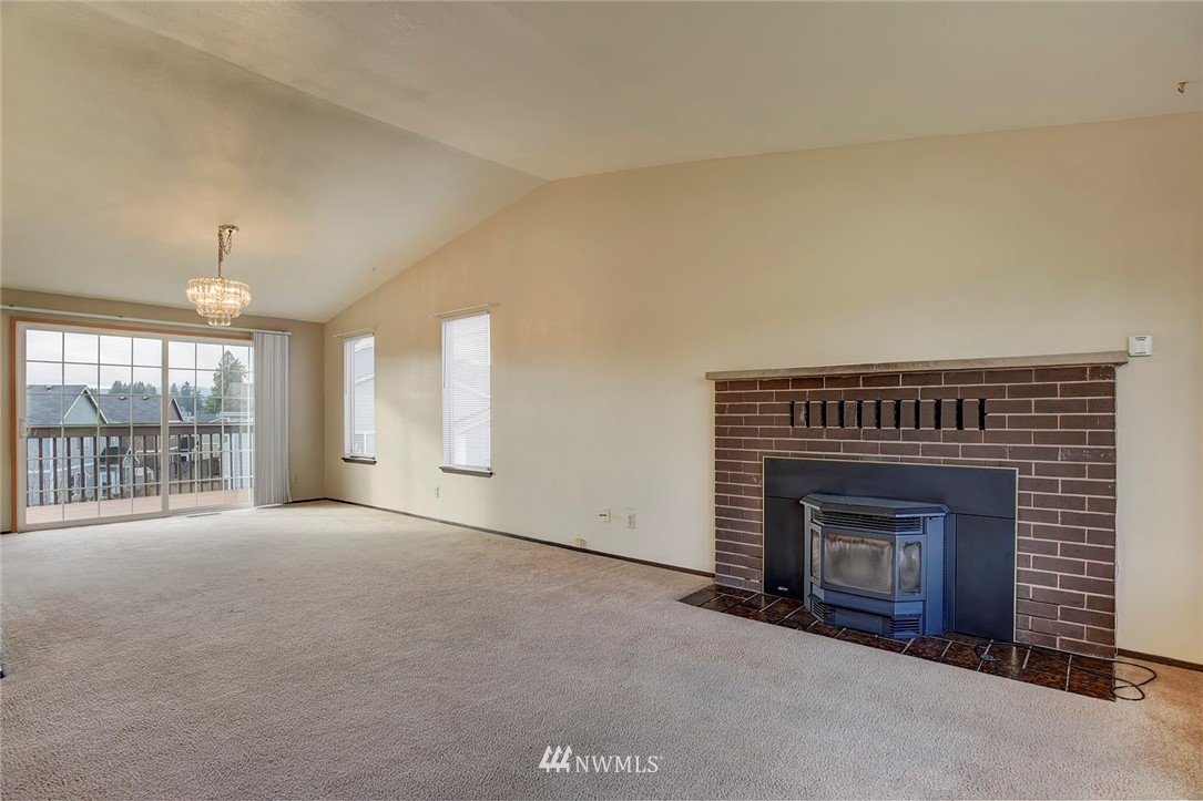 2801 Sierra Road Bremerton, WA 98310 - Photo 3 of 23 an empty room with windows and fireplace
