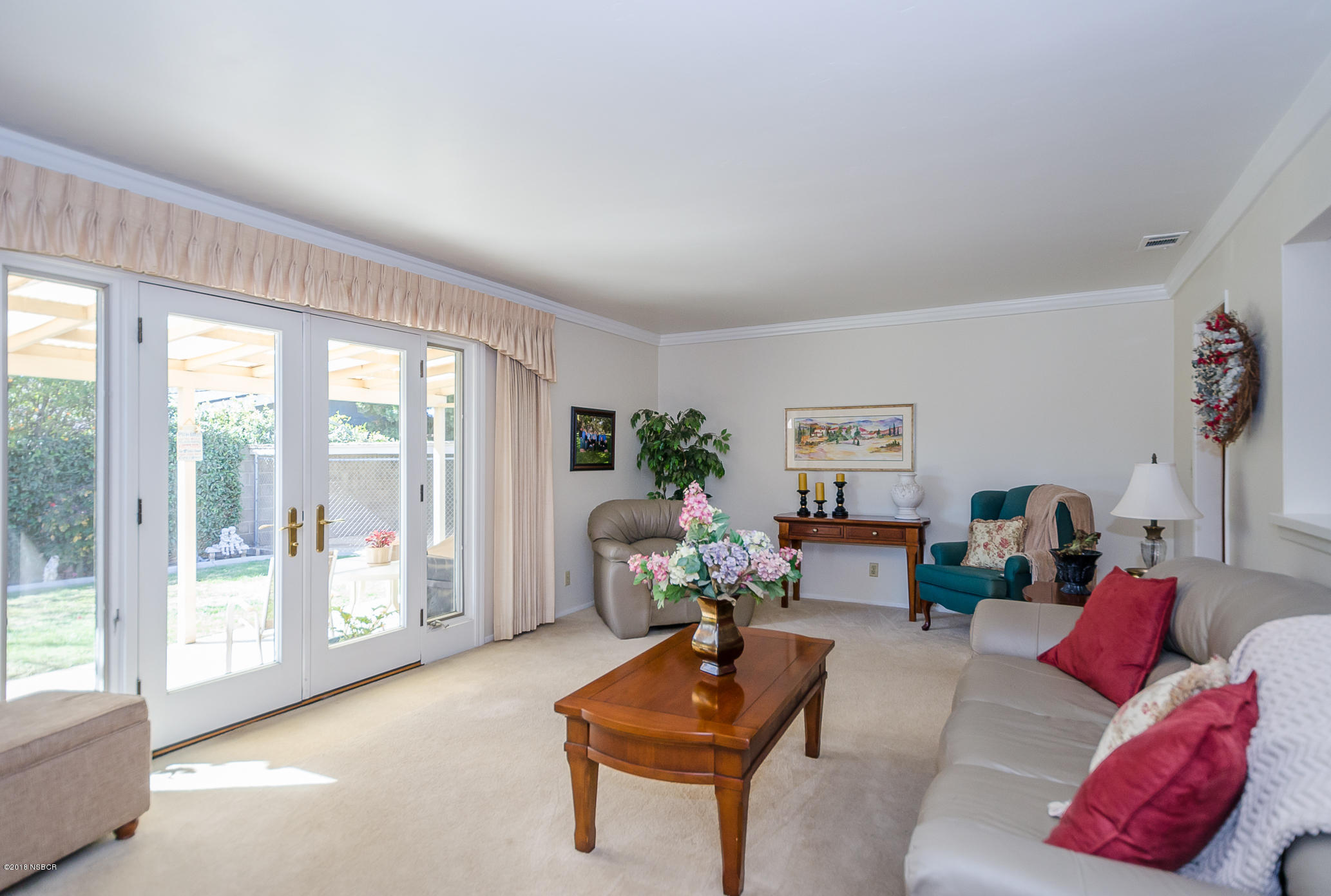519 North Bradley Road Santa Maria, CA 93454 - Photo 12 of 27 a living room with furniture and a large window