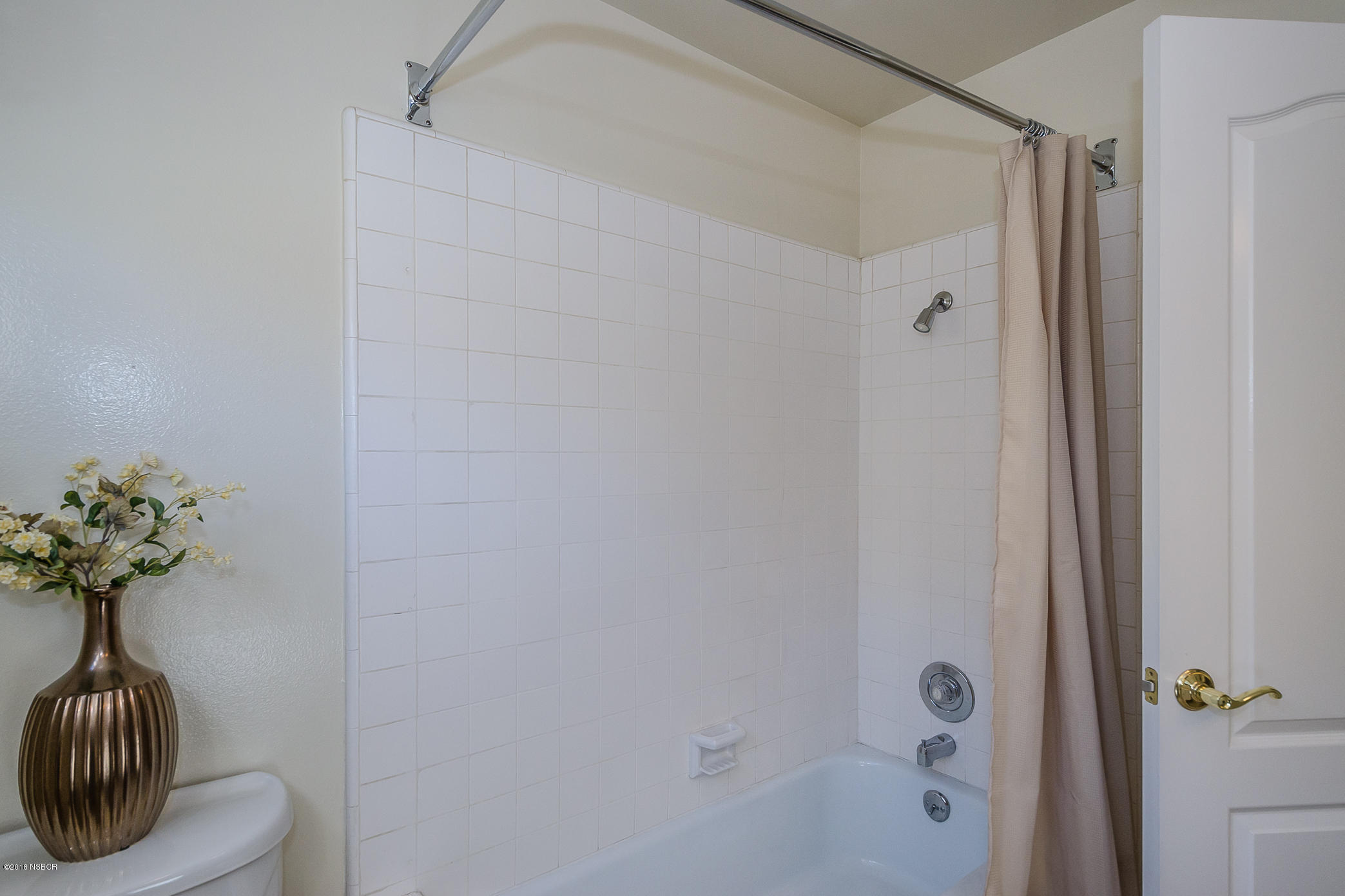 519 North Bradley Road Santa Maria, CA 93454 - Photo 17 of 27 a bathroom with a shower and a sink