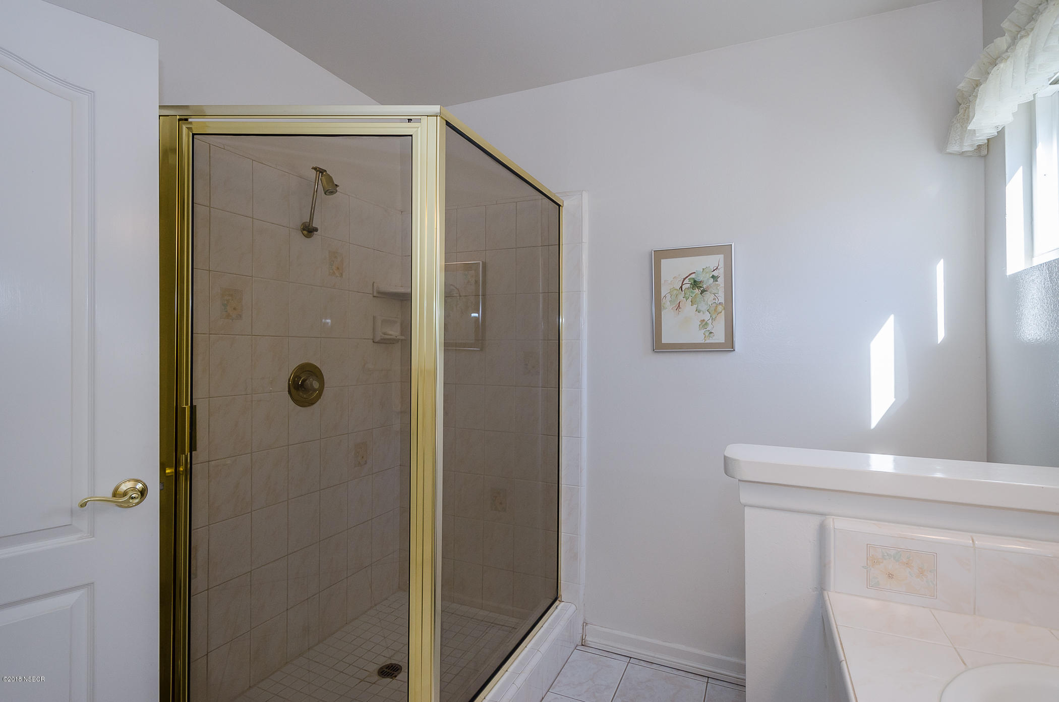 519 North Bradley Road Santa Maria, CA 93454 - Photo 22 of 27 a bathroom with a shower and a sink