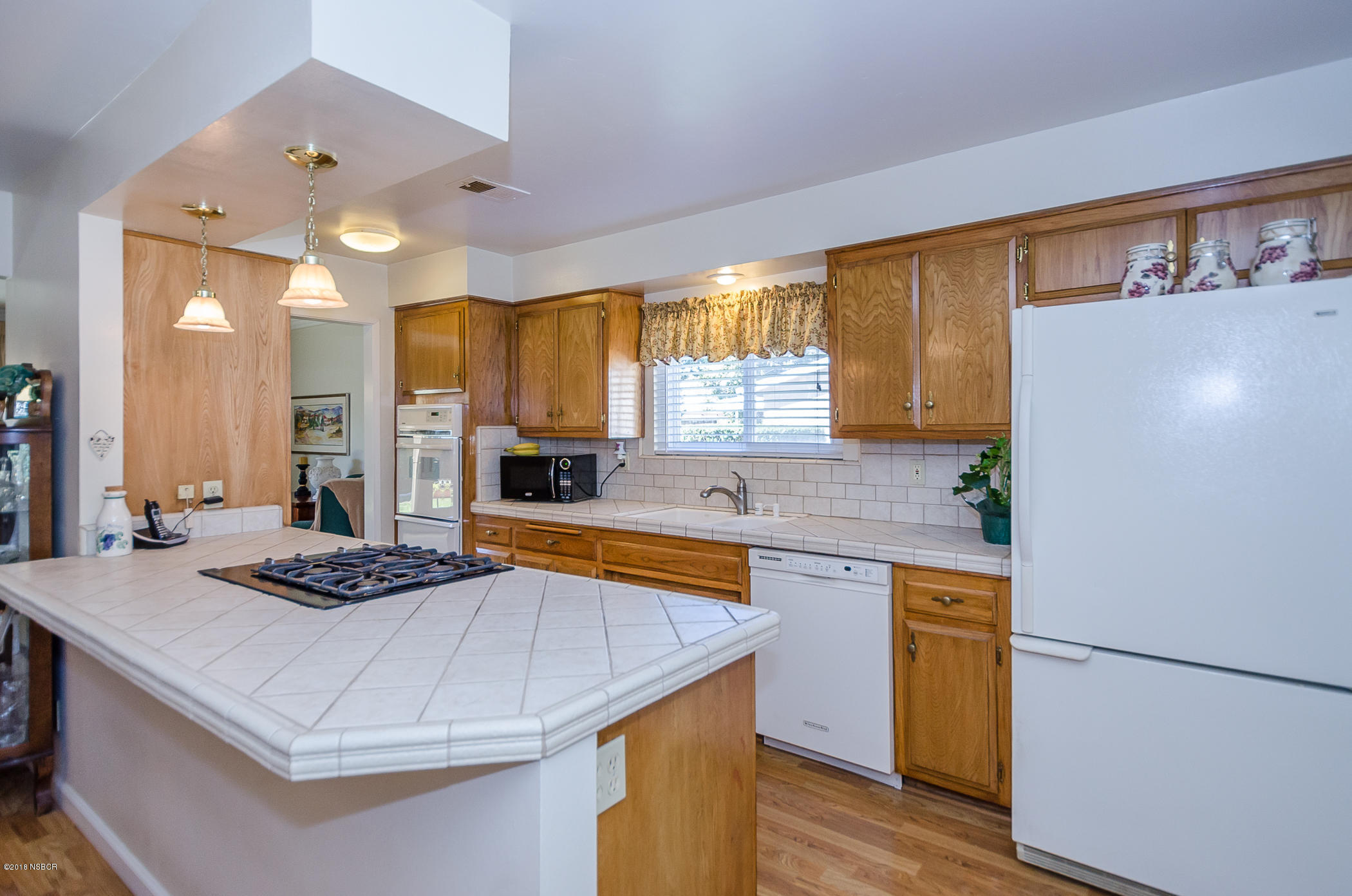 519 North Bradley Road Santa Maria, CA 93454 - Photo 6 of 27 a kitchen with a sink appliances and cabinets
