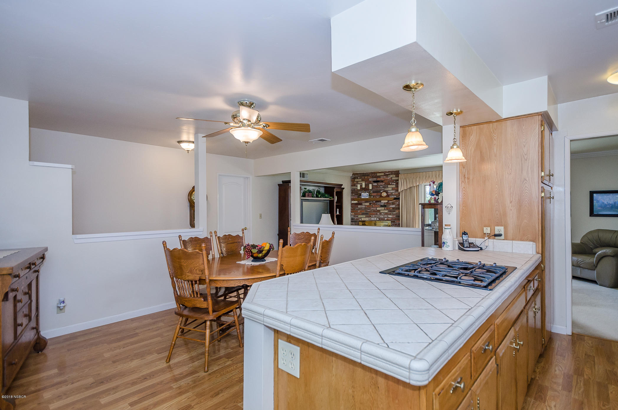 519 North Bradley Road Santa Maria, CA 93454 - Photo 7 of 27 a view of a dining room with furniture and wooden floor