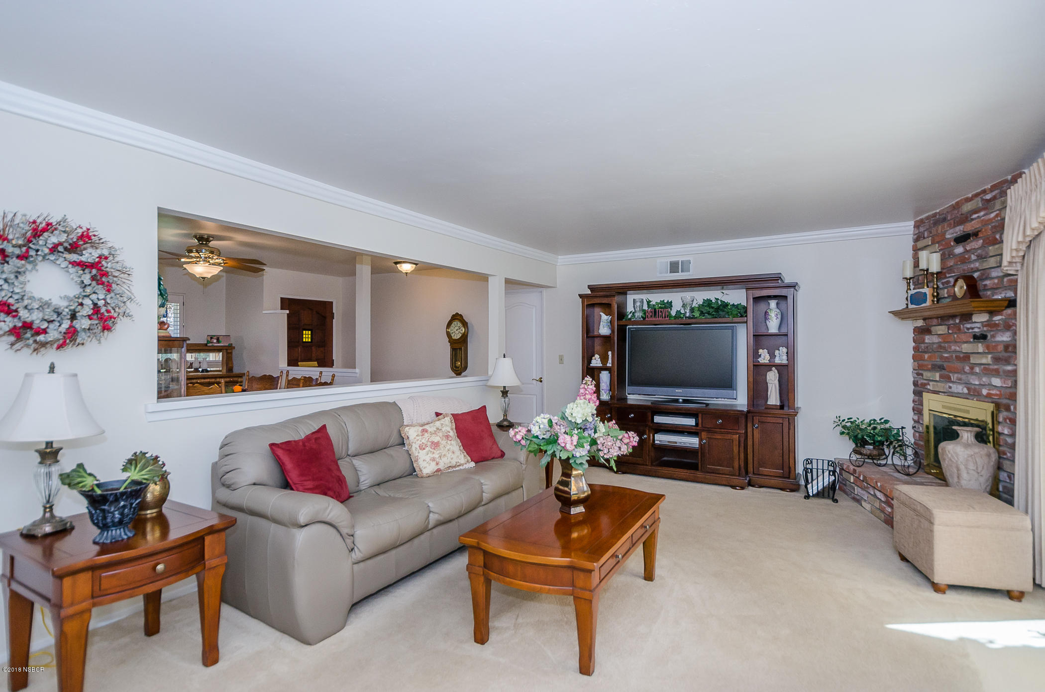 519 North Bradley Road Santa Maria, CA 93454 - Photo 10 of 27 a living room with furniture and a flat screen tv