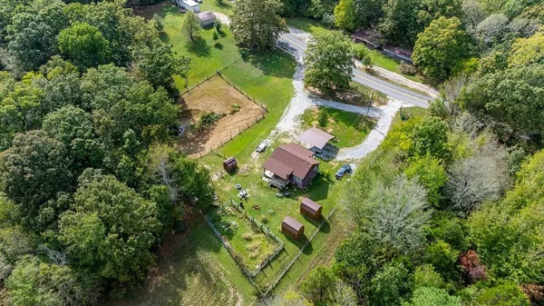 an aerial view of house with yard