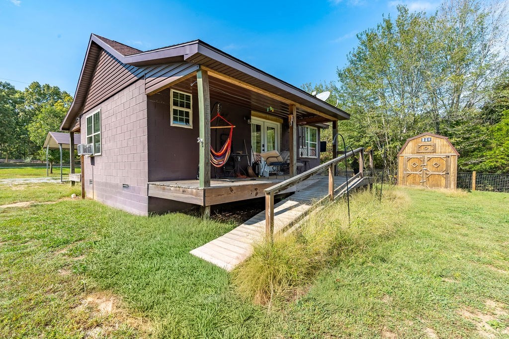 14396 S Road Cadiz, KY 42211 - Photo 3 of 15 a view of a house with backyard and trees