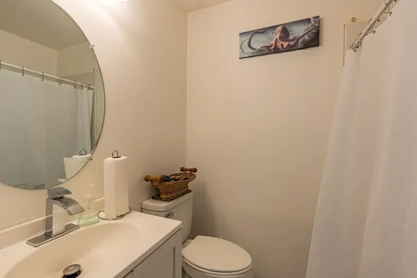 a bathroom with a sink and toilet