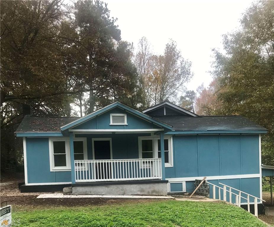 116 Edwards Street Bremen, GA 30110 - Photo 1 of 33 a front view of a house with a garden
