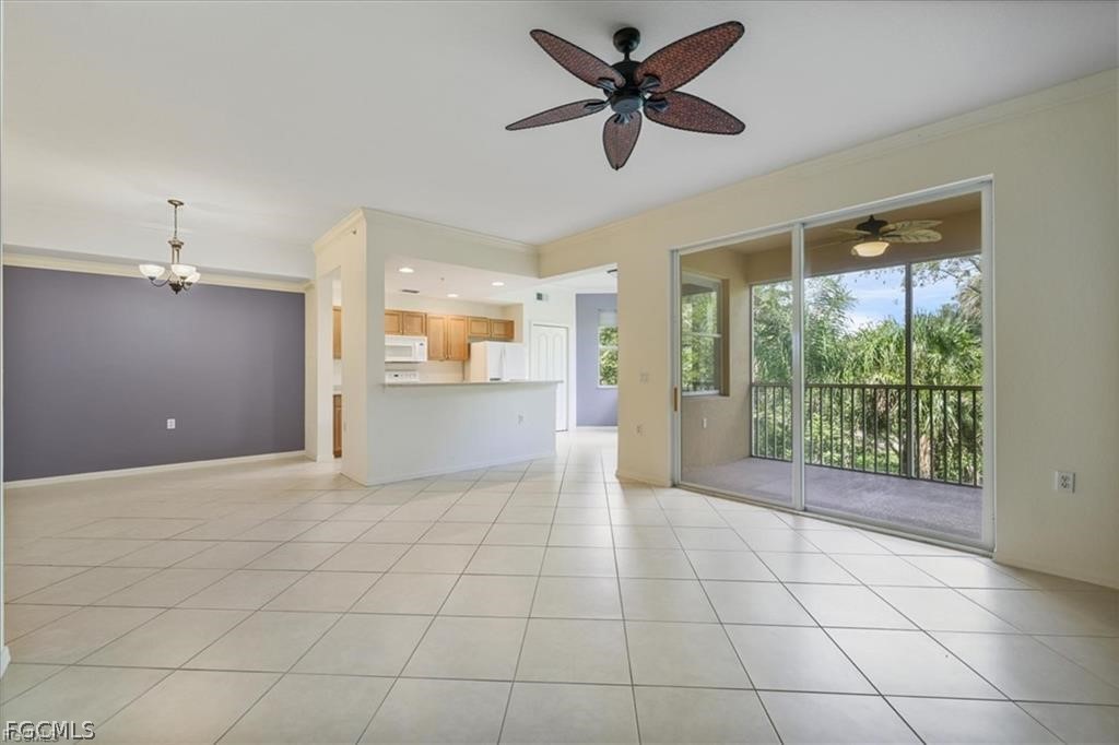 8261 Pathfinder Loop, Unit 738 Fort Myers, FL 33919 - Photo 6 of 22 a view of a livingroom with a ceiling fan and window