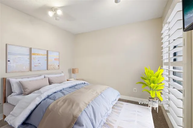 a bedroom with a bed and a balcony