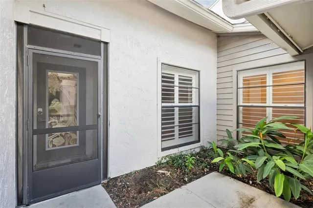 a potted plant in front of a house