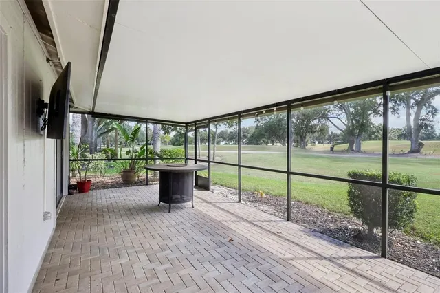a view of a porch with wooden floor and stairs